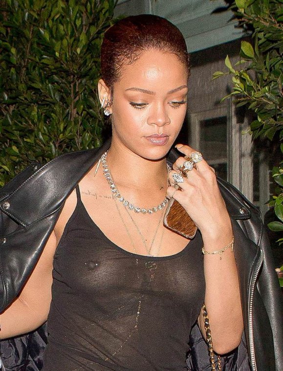 rihanna-braless-outdoor-in-see-through-black-top-4.jpg